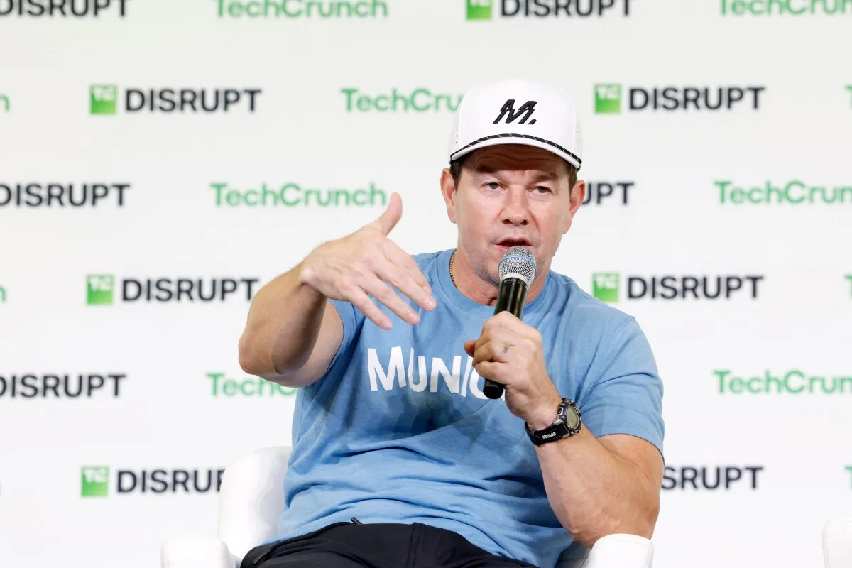 Illustration from TechCrunch: Mark Wahlberg says he is open to an heir-controlled AI likeness and AI-enhanced stadium scenes for a Pete Rose film